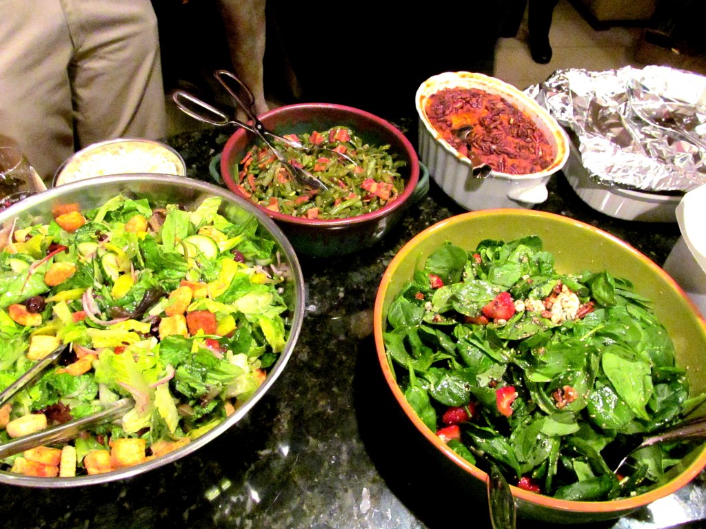 Caesar salad with olives/tomatoes, spinach salad with strawberries, green beans/bacon, sweet potatoes/candied pecans.