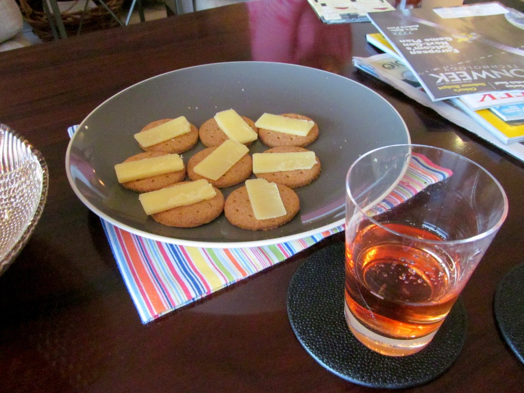 I should not be drinking this unique cabernet rose before I even get to dinner, where I will drink with my meal. And there will probably be bread at dinner, so why am I eating the crackers? How many should I eat?