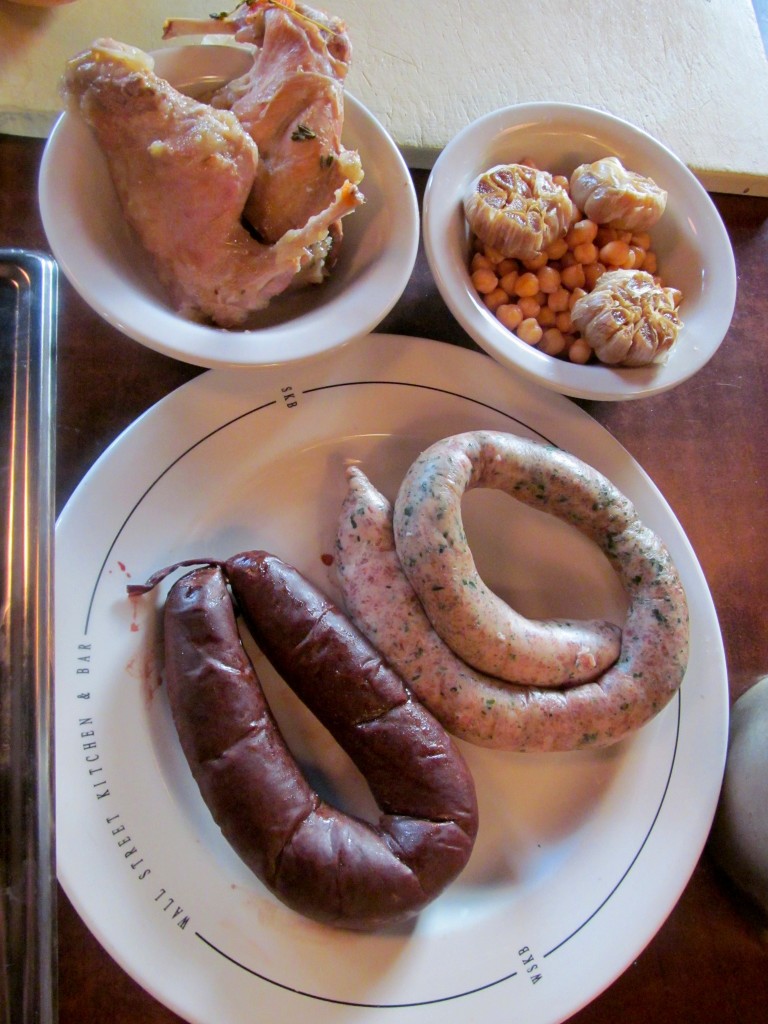 Selvaje paella ingredients: rabbit, chickpeas, blood sausage, house-made white sausage.